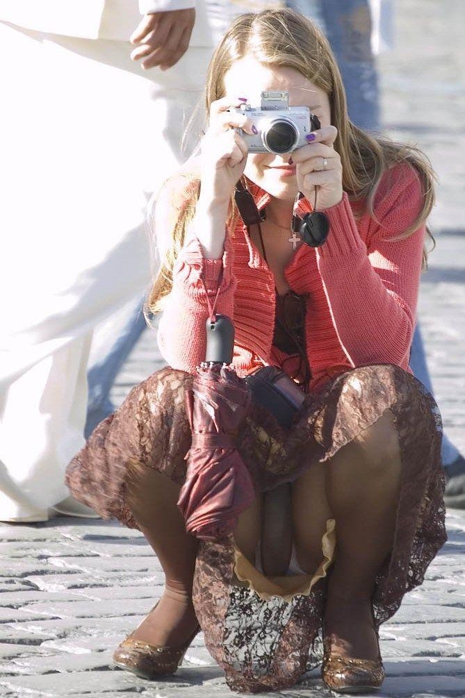 Blonde Young Woman Upskirt wearing Brown Opaque Pantyhose and Brown Long Skirt